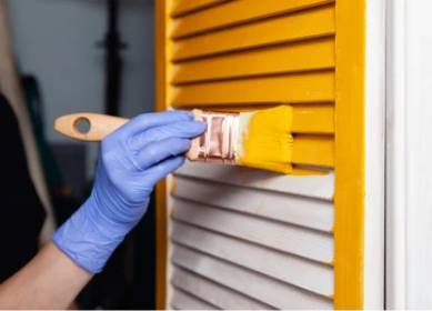 Grill and door painting in progress using anti-rust yellow paint